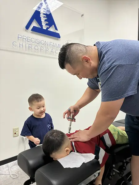 Gene Xiong Adjusting A Child