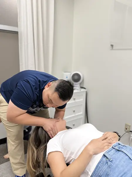 Gene Xiong Adjusting A Patients Neck